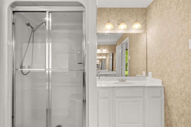 bathroom with vanity and an enclosed shower