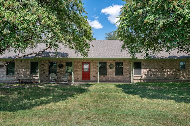 ranch-style home with a front lawn