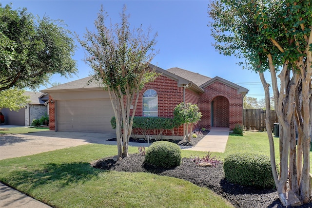 ranch-style house featuring a garage and a front lawn