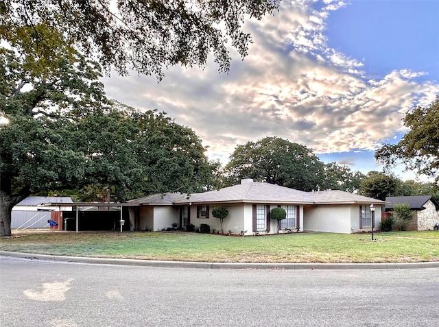 ranch-style house with a front yard