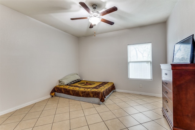 tiled bedroom with ceiling fan