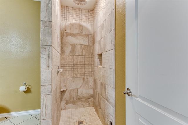 bathroom with a tile shower