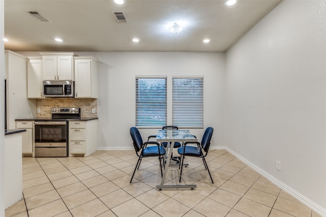 dining space with light tile patterned floors