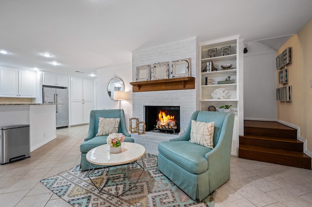 tiled living room with a brick fireplace