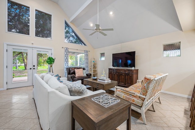 tiled living room with a wealth of natural light, french doors, high vaulted ceiling, and ceiling fan