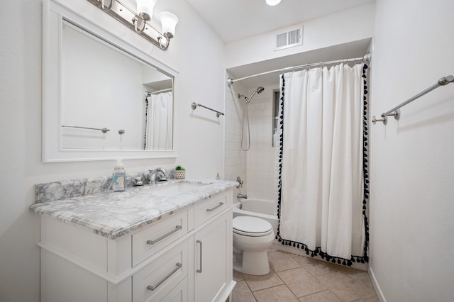 full bathroom with tile patterned floors, vanity, shower / tub combo, and toilet