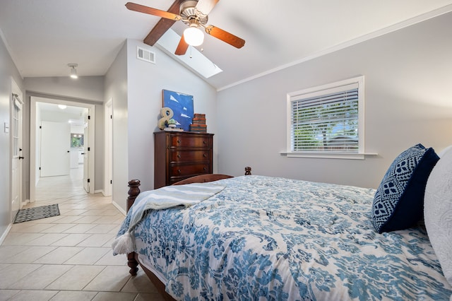 bedroom featuring multiple windows, ceiling fan, lofted ceiling, and light tile patterned flooring