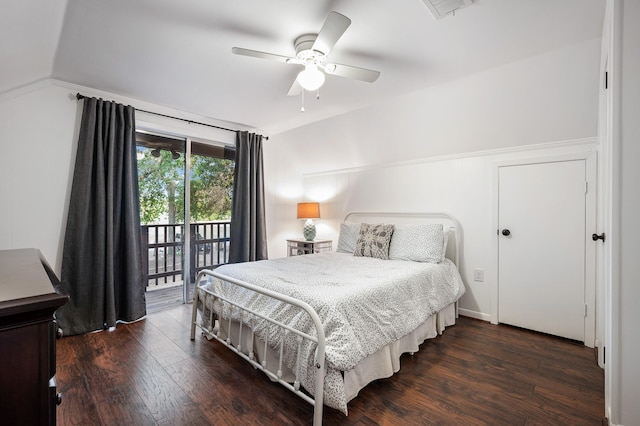 bedroom featuring dark wood-style floors, access to outside, visible vents, and vaulted ceiling