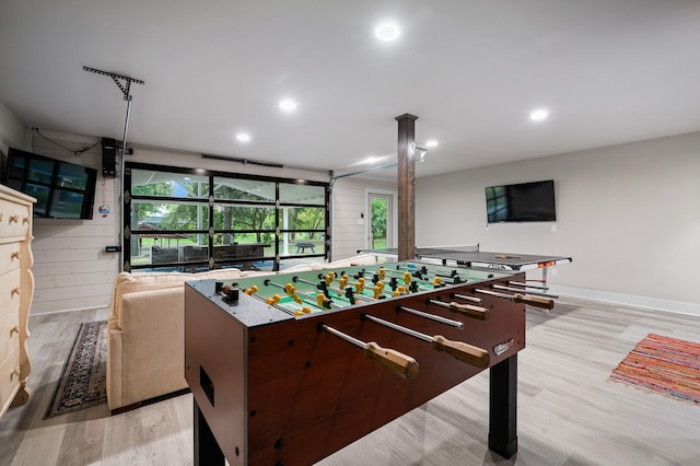 rec room with decorative columns and light hardwood / wood-style floors