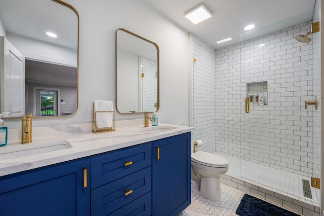 full bath with a stall shower, tile patterned flooring, a sink, and toilet