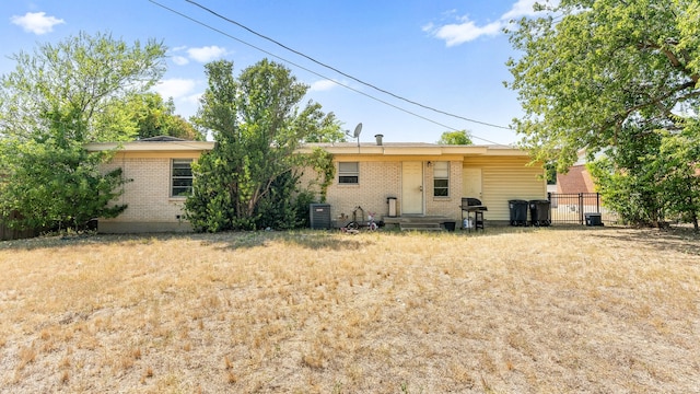 rear view of property with central air condition unit