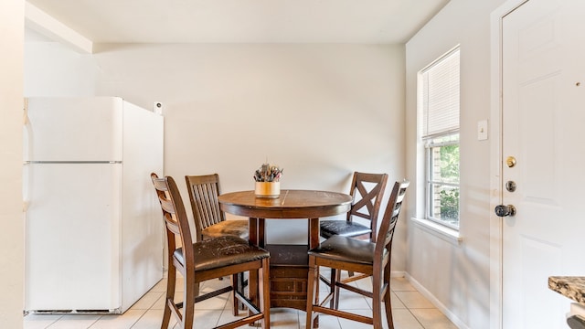 dining area featuring light tile patterned flooring