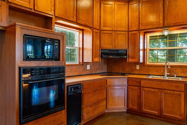 kitchen with black appliances and sink