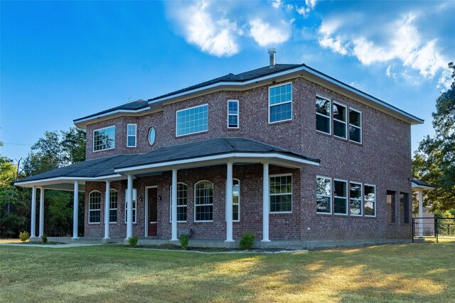 view of front facade featuring a front lawn and a porch