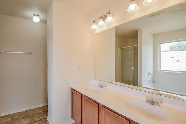 bathroom with tile patterned flooring, vanity, independent shower and bath, and a textured ceiling