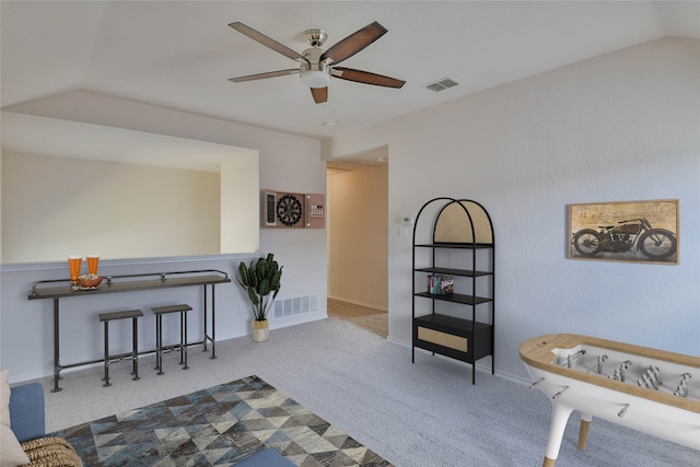 sitting room with light carpet, ceiling fan, and lofted ceiling