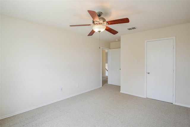 unfurnished bedroom with ceiling fan and light carpet