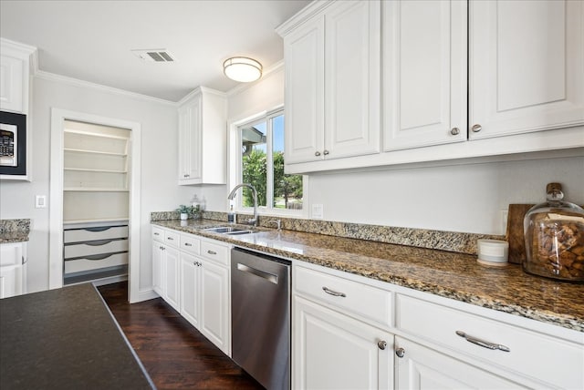 kitchen featuring dark stone counters, appliances with stainless steel finishes, sink, and dark wood-type flooring