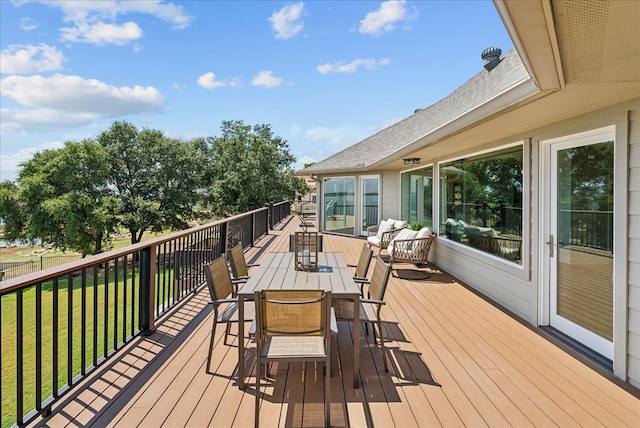 wooden terrace with a yard