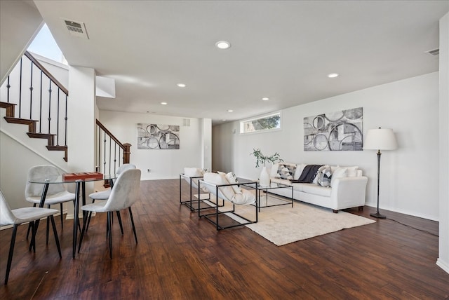 living room with dark hardwood / wood-style flooring