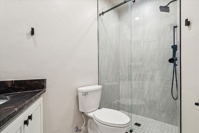 bathroom with walk in shower, toilet, and vanity