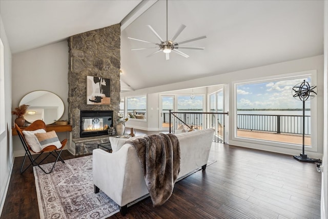 living room with beamed ceiling, a stone fireplace, high vaulted ceiling, hardwood / wood-style flooring, and ceiling fan