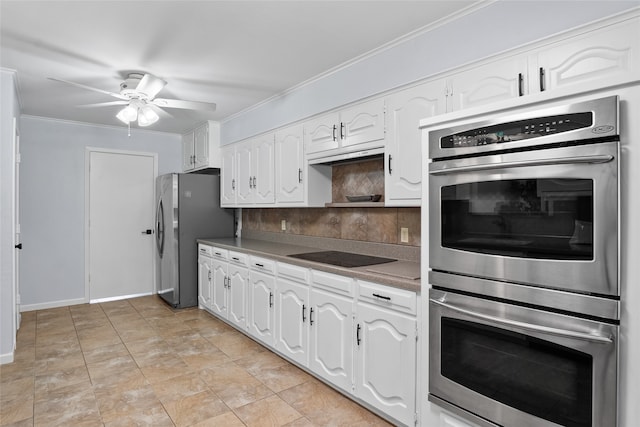 kitchen featuring appliances with stainless steel finishes, ornamental molding, decorative backsplash, ceiling fan, and white cabinets