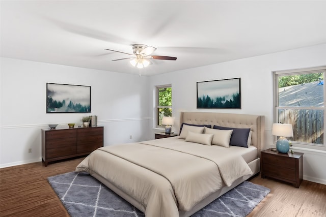 bedroom featuring wood-type flooring and ceiling fan