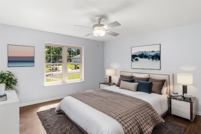 bedroom featuring dark wood-type flooring and ceiling fan