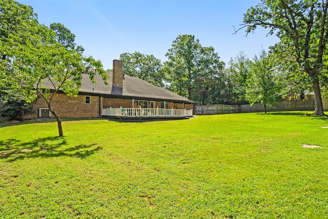 view of yard featuring a wooden deck