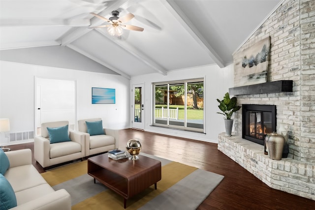 living room featuring a fireplace, hardwood / wood-style floors, ceiling fan, and vaulted ceiling with beams