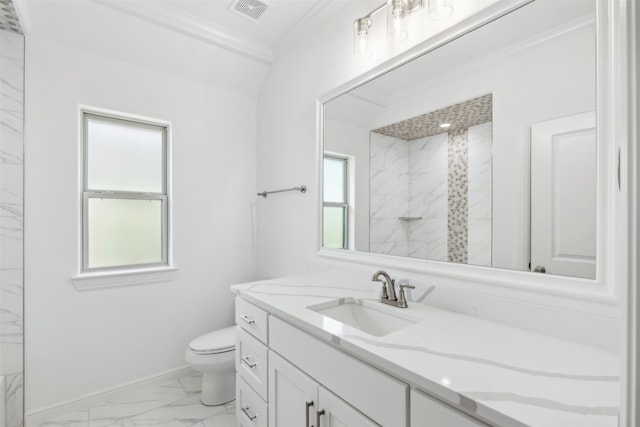 bathroom featuring crown molding, vanity, toilet, and a shower