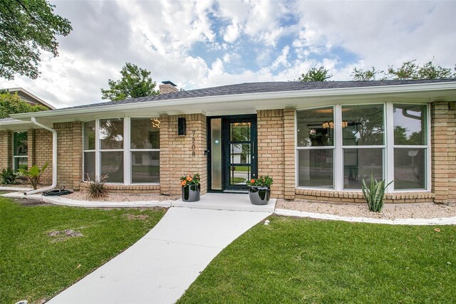 single story home with brick siding