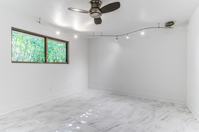 washroom with washing machine and dryer, cabinet space, light tile patterned floors, and baseboards