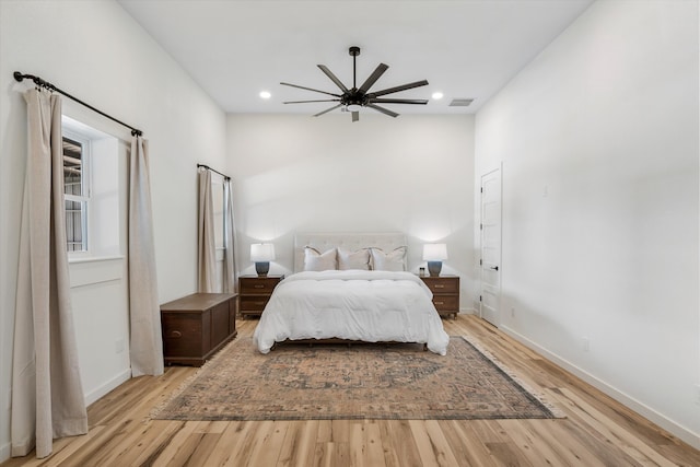 bedroom with light wood-type flooring and ceiling fan