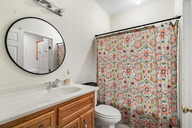 bathroom with vanity, toilet, and a shower with shower curtain