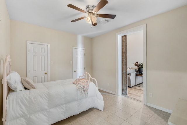 bedroom featuring ceiling fan and light tile patterned floors