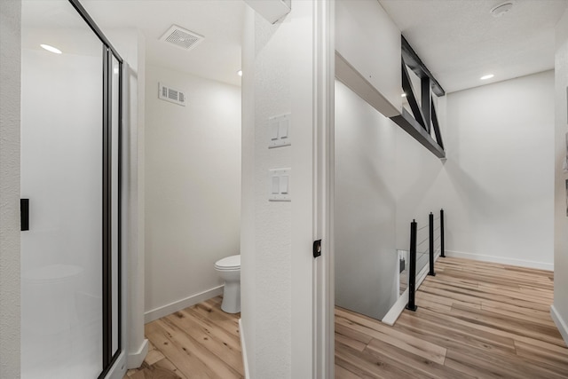 stairs featuring wood-type flooring