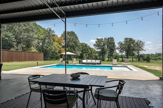 view of swimming pool featuring a patio area and a lawn