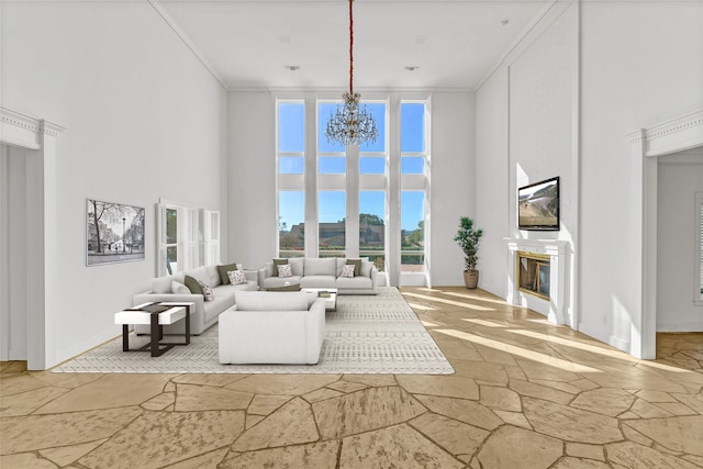 unfurnished living room with crown molding, a notable chandelier, and a high ceiling