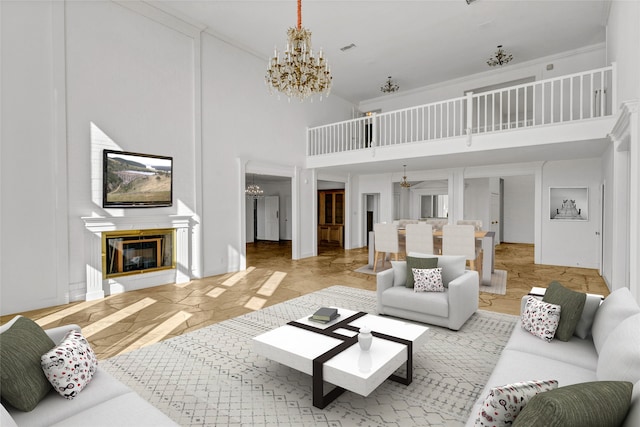 living room with a high ceiling and an inviting chandelier