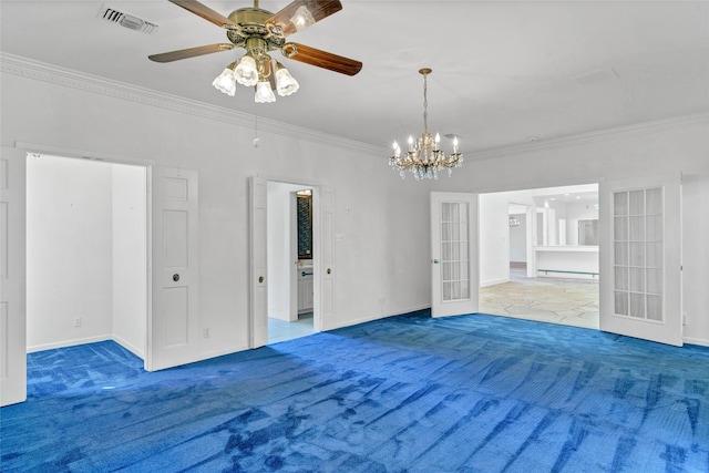 unfurnished dining area featuring crown molding, carpet flooring, and ceiling fan with notable chandelier