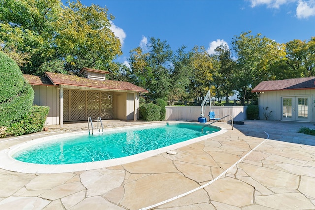 view of swimming pool with a patio