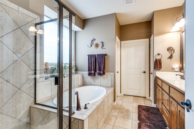 bathroom featuring vanity, tile patterned floors, and separate shower and tub