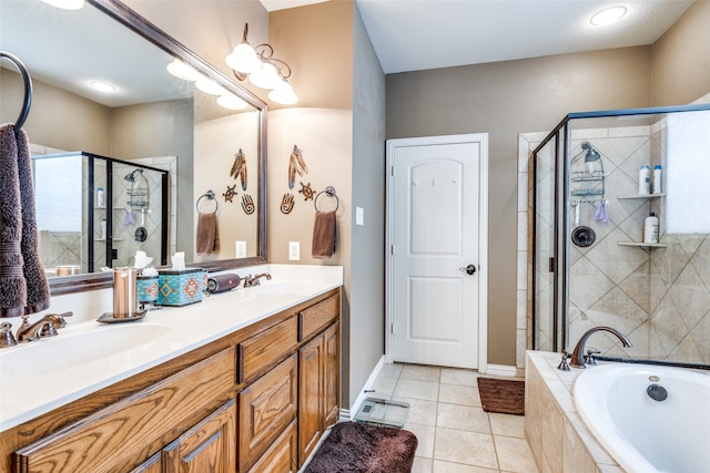 bathroom featuring vanity, shower with separate bathtub, and tile patterned flooring