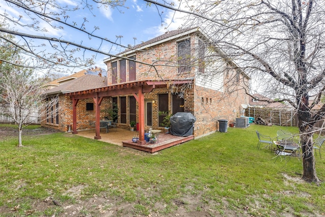 back of house with a patio, cooling unit, a yard, and a wooden deck