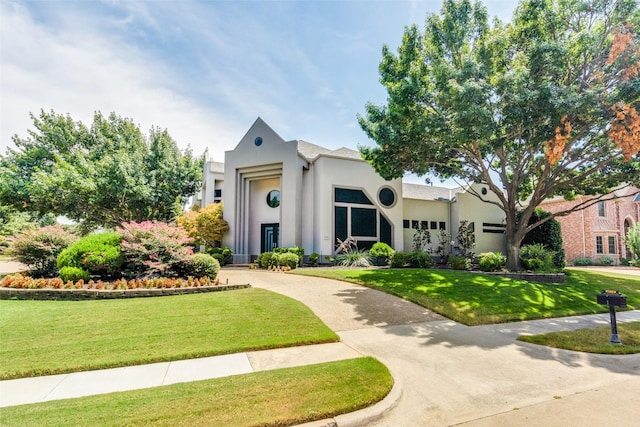 view of front of property with a front lawn