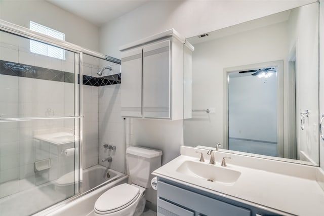 full bathroom with toilet, shower / bath combination with glass door, and vanity