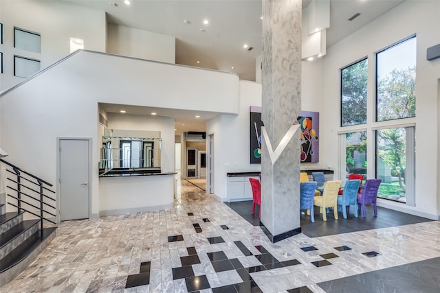 interior space featuring a towering ceiling