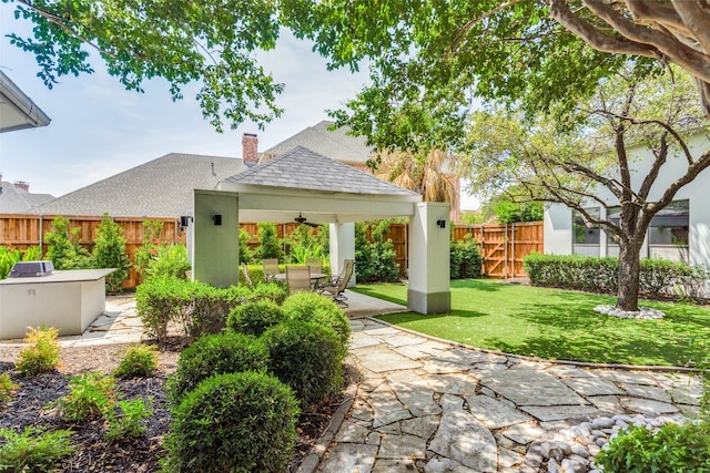 exterior space with a gazebo, a patio, and ceiling fan